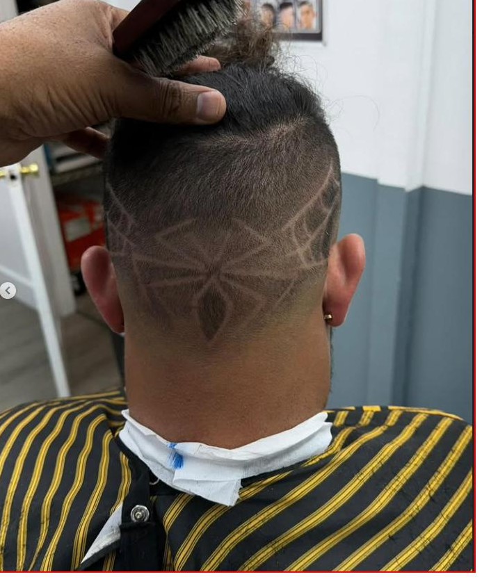 Floral hair design carved into a fade at Unlimited Barbershop in Danbury, CT